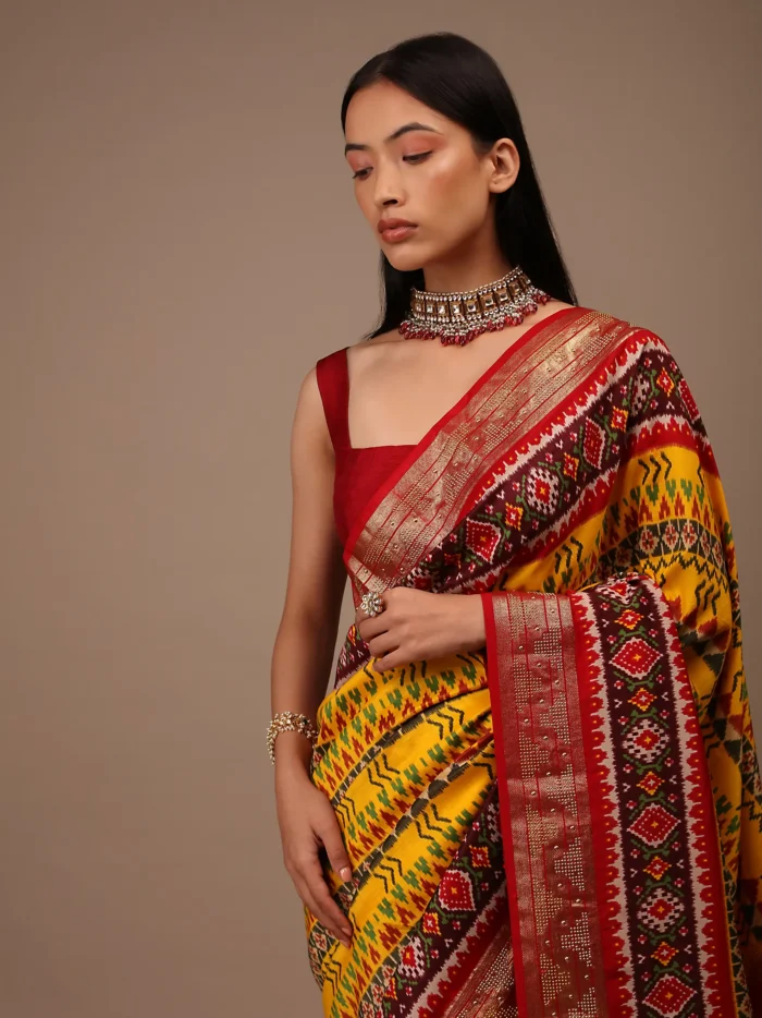 chrome_yellow_saree_in_silk_with_multi_colored_patola1.webp