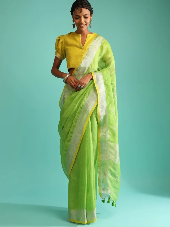 parrot-green-saree-in-linen-with-silver-brocade-border-and-striped-pallu-along-with-yellow-unstitched-blouse.webp