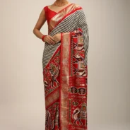 red_saree_in_silk_with_multi_colored_patola_print.webp