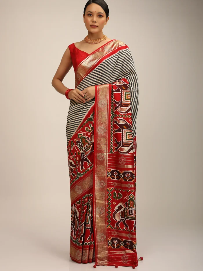 red_saree_in_silk_with_multi_colored_patola_print.webp