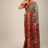 red_saree_in_silk_with_multi_colored_patola_print1.webp