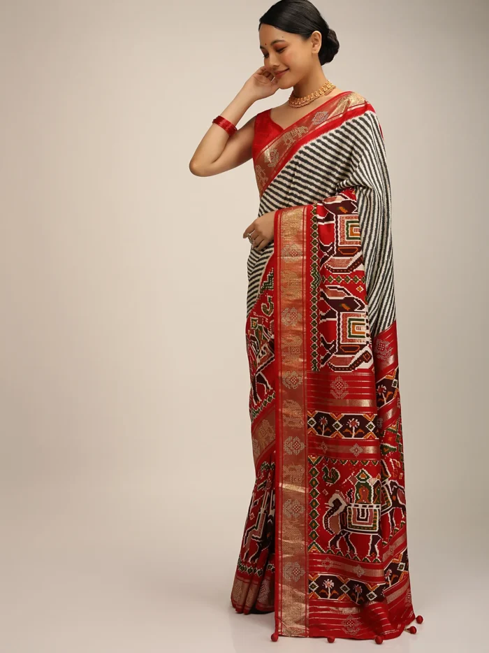 red_saree_in_silk_with_multi_colored_patola_print1.webp