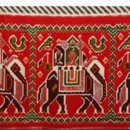 red_saree_in_silk_with_multi_colored_patola_print5.webp